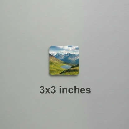 Fridge magnet with a mountain landscape on a metallic refrigerator