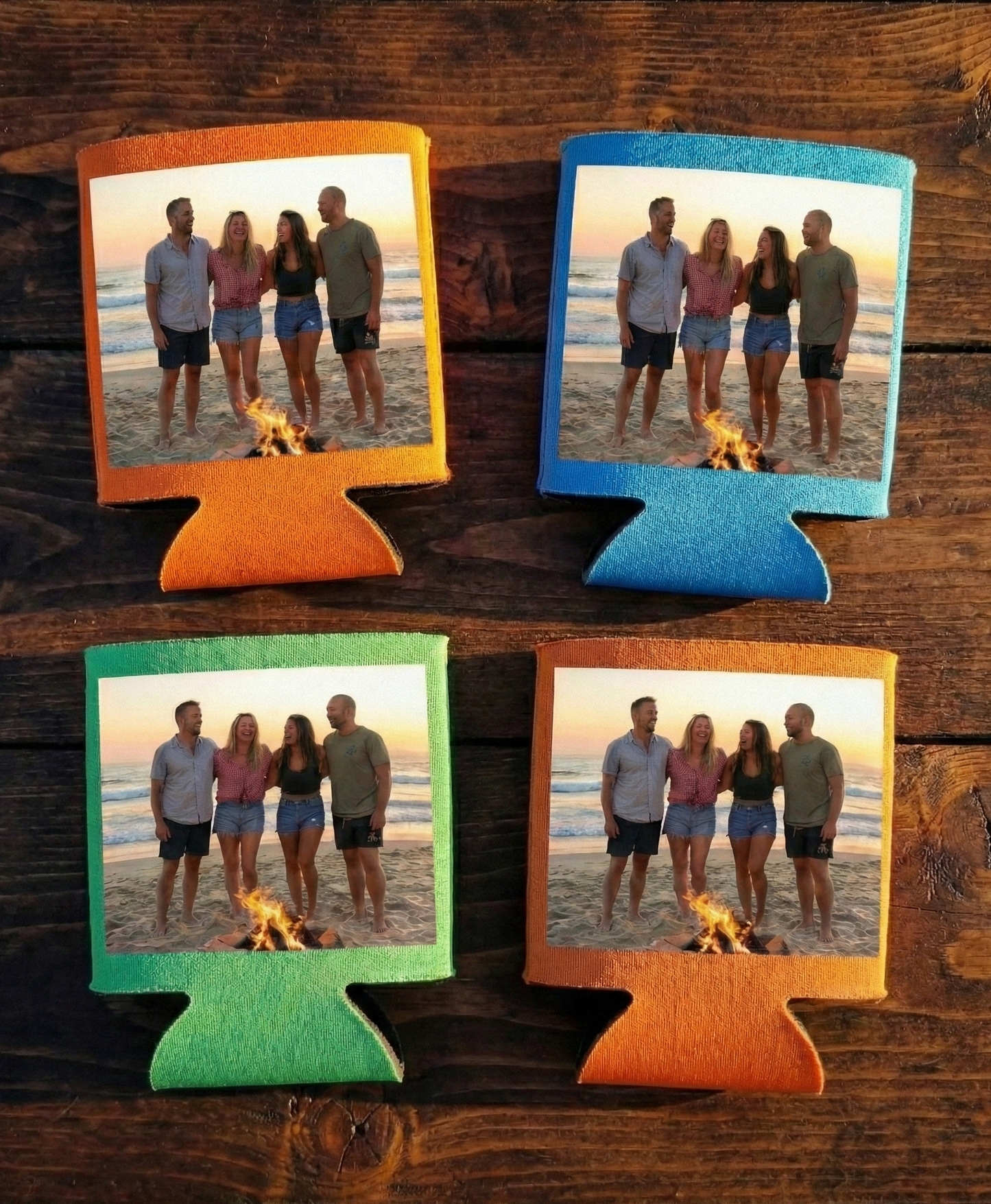 Four colorful can coolers with printed images of a group on a beach.