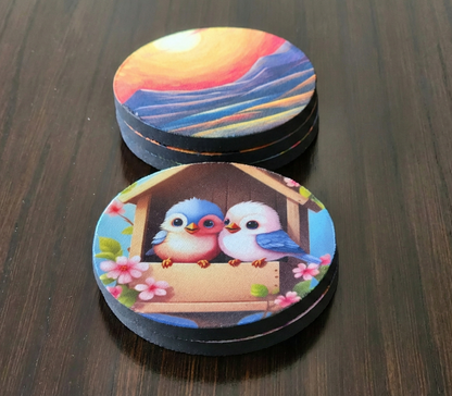 Two round coasters with colorful designs on a wooden surface