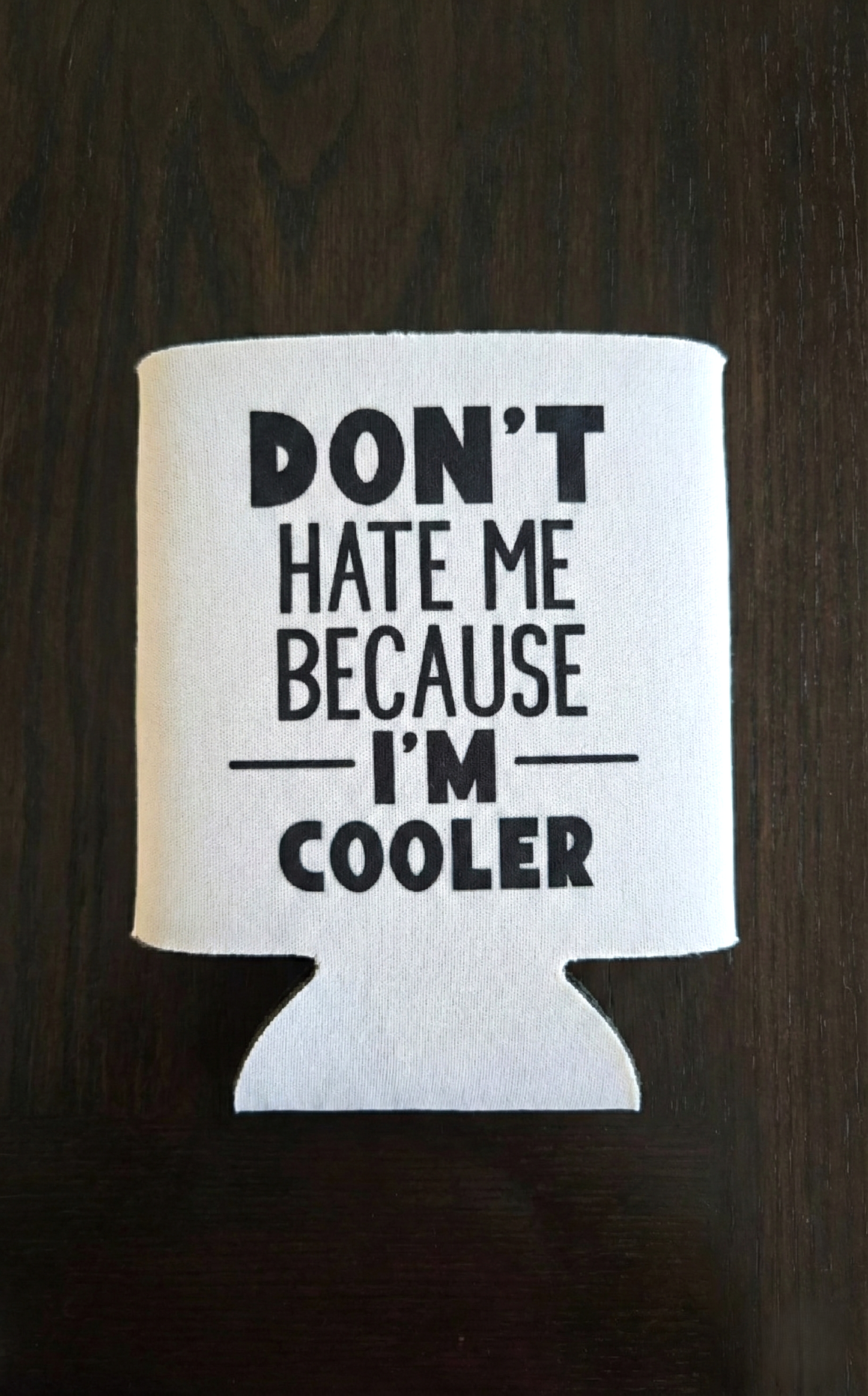 White can cooler with black text on a dark background