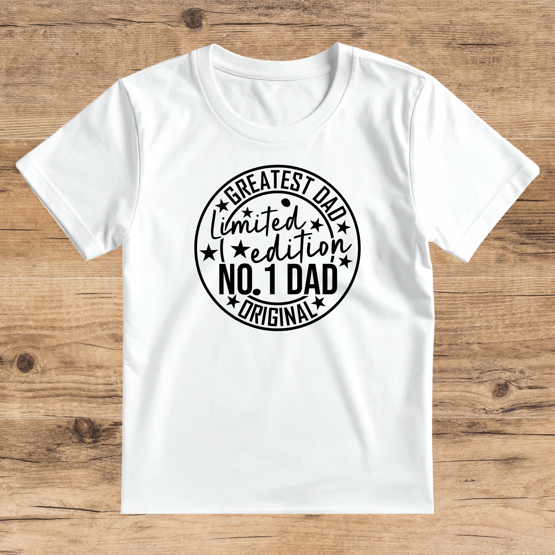 White t-shirt with black text on a wooden surface