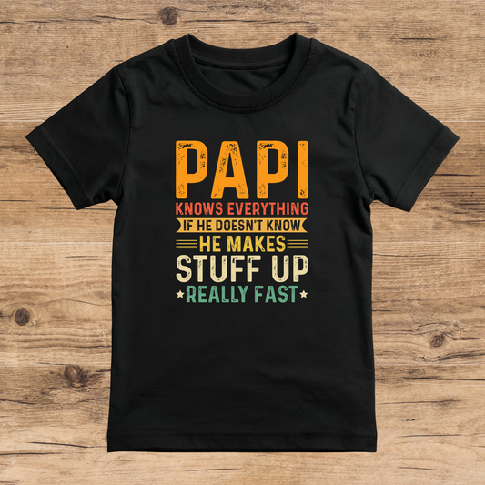 Black t-shirt with colorful text on a wooden surface