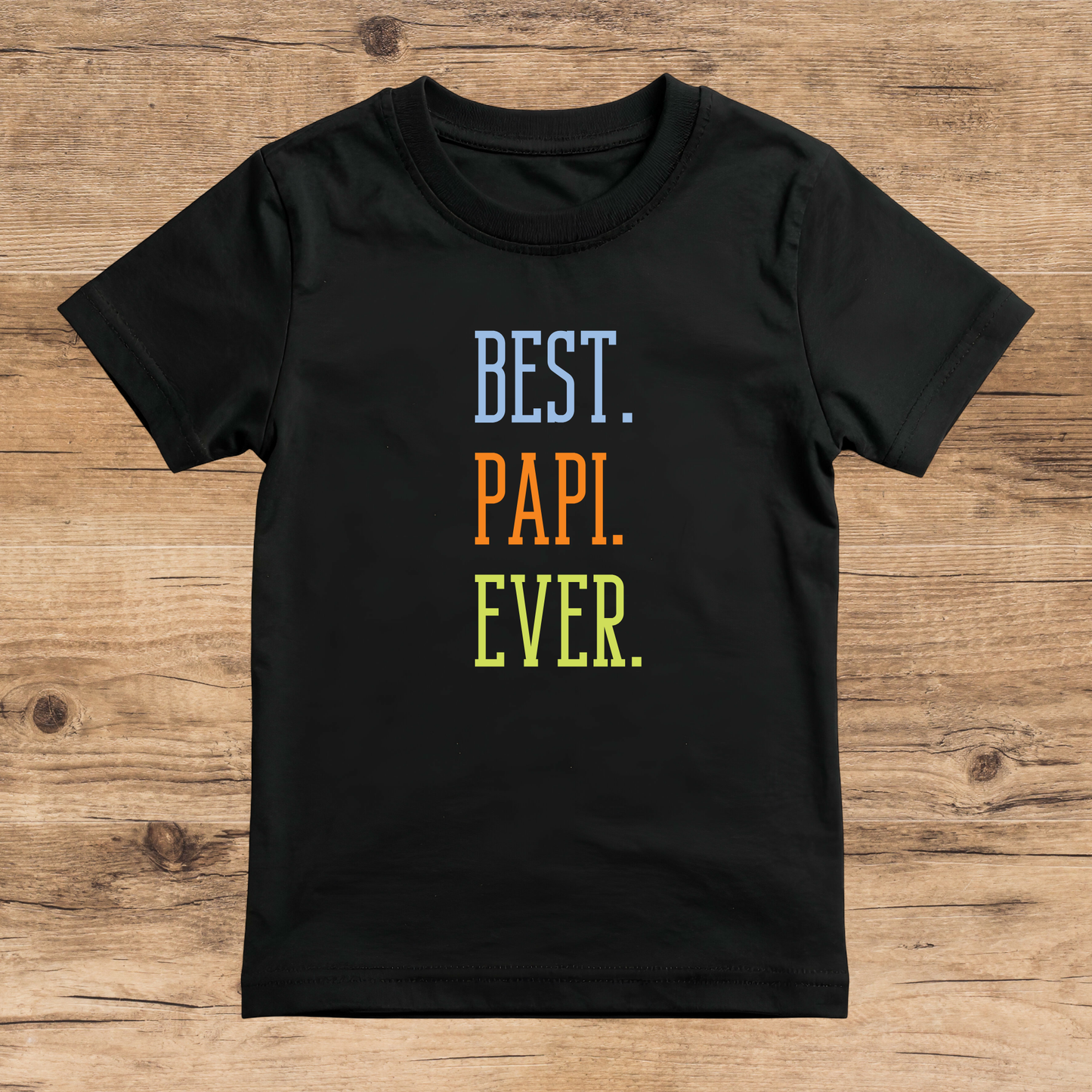 Black t-shirt with 'BEST. PAPI. EVER.' text on a wooden surface