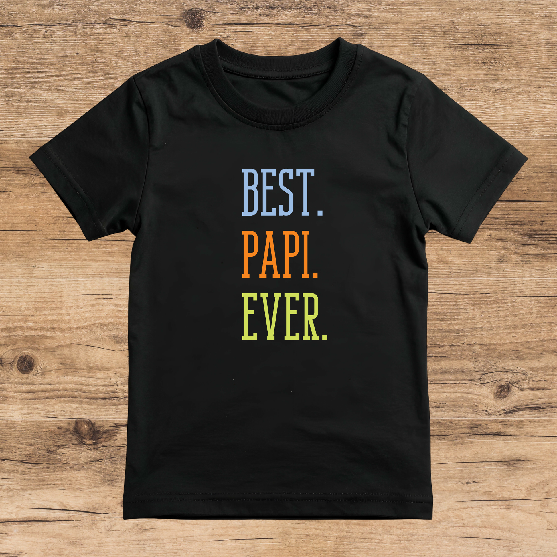 Black t-shirt with 'BEST. PAPI. EVER.' text on a wooden surface