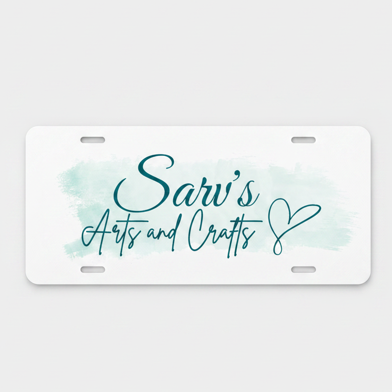 A white novelty license plate with rounded corners, featuring a light blue watercolor wash background and teal script text that reads 'Sarv's Arts and Crafts' with a heart outline.