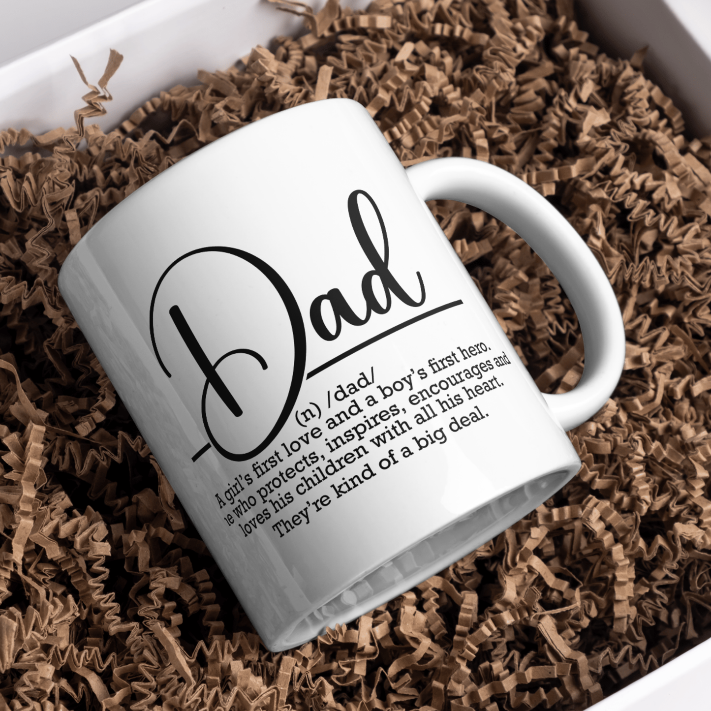 White mug with 'Dad' definition text on brown crinkled paper