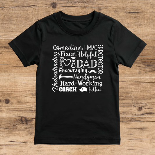 Black t-shirt with white text on a wooden surface