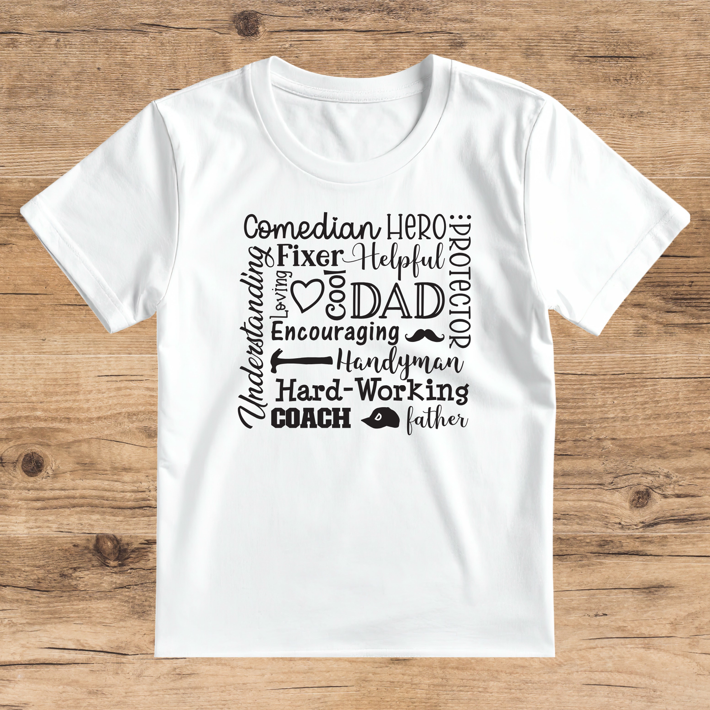 White t-shirt with black text on a wooden surface