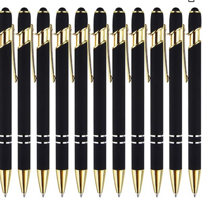 Row of black pens with gold accents on a white background