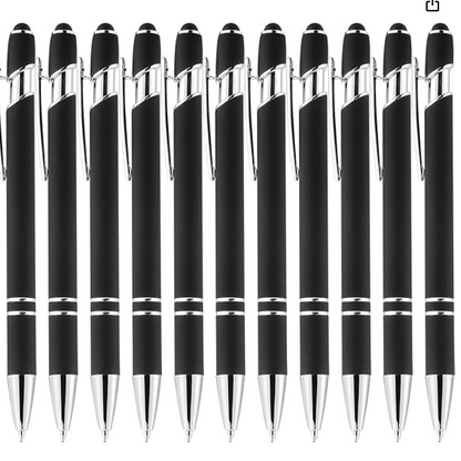 Row of black pens with silver accents on a white background