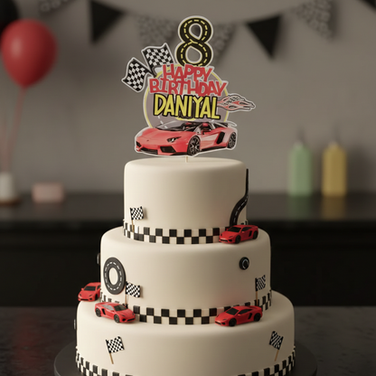 Three-tiered birthday cake with race car theme and 'Happy Birthday Danyal' topper.