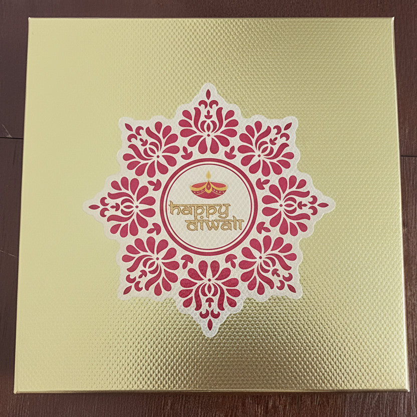 Yellow gift bag with red floral design on a wooden surface