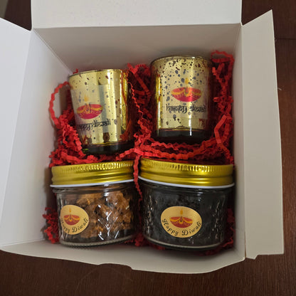 Three small jars with gold lids in a white box on a wooden surface