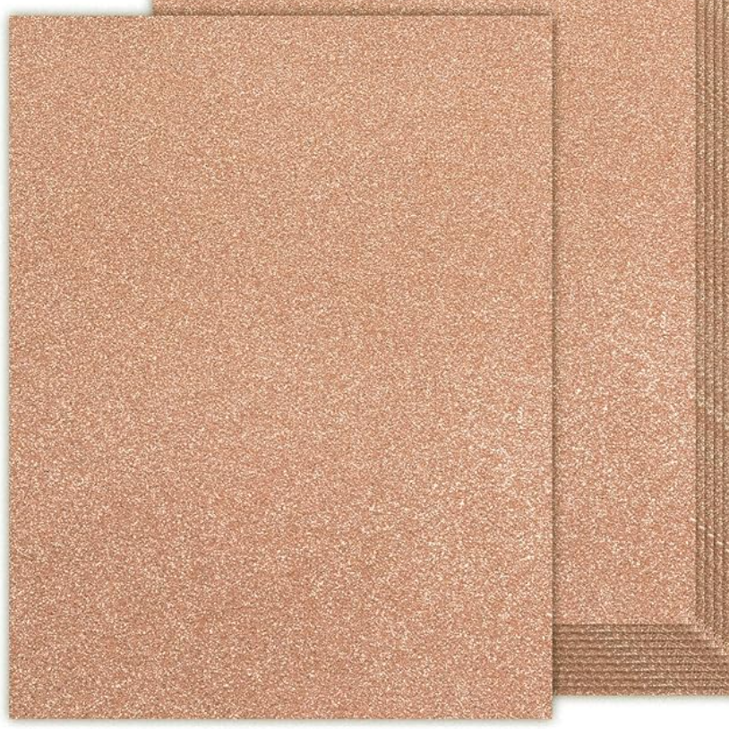 Two pieces of rose gold textured paper on a white background