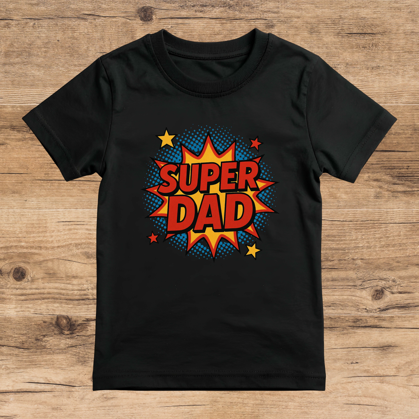 Black t-shirt with 'Super Dad' graphic on a wooden surface