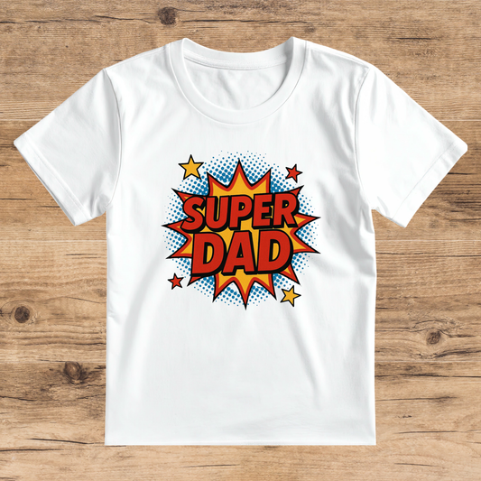 White t-shirt with 'Super Dad' graphic on a wooden surface